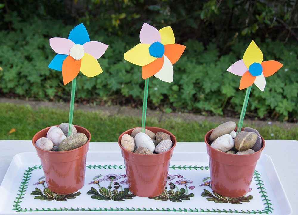 3 colourful paper flowers in pots